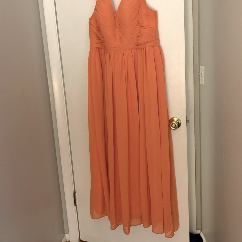 Orange floor length formal gown.